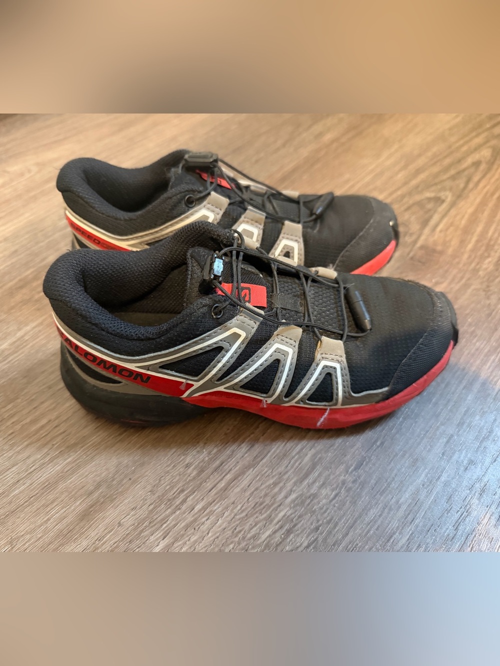 Salomon Black and Red kids Trail Running Sneakers